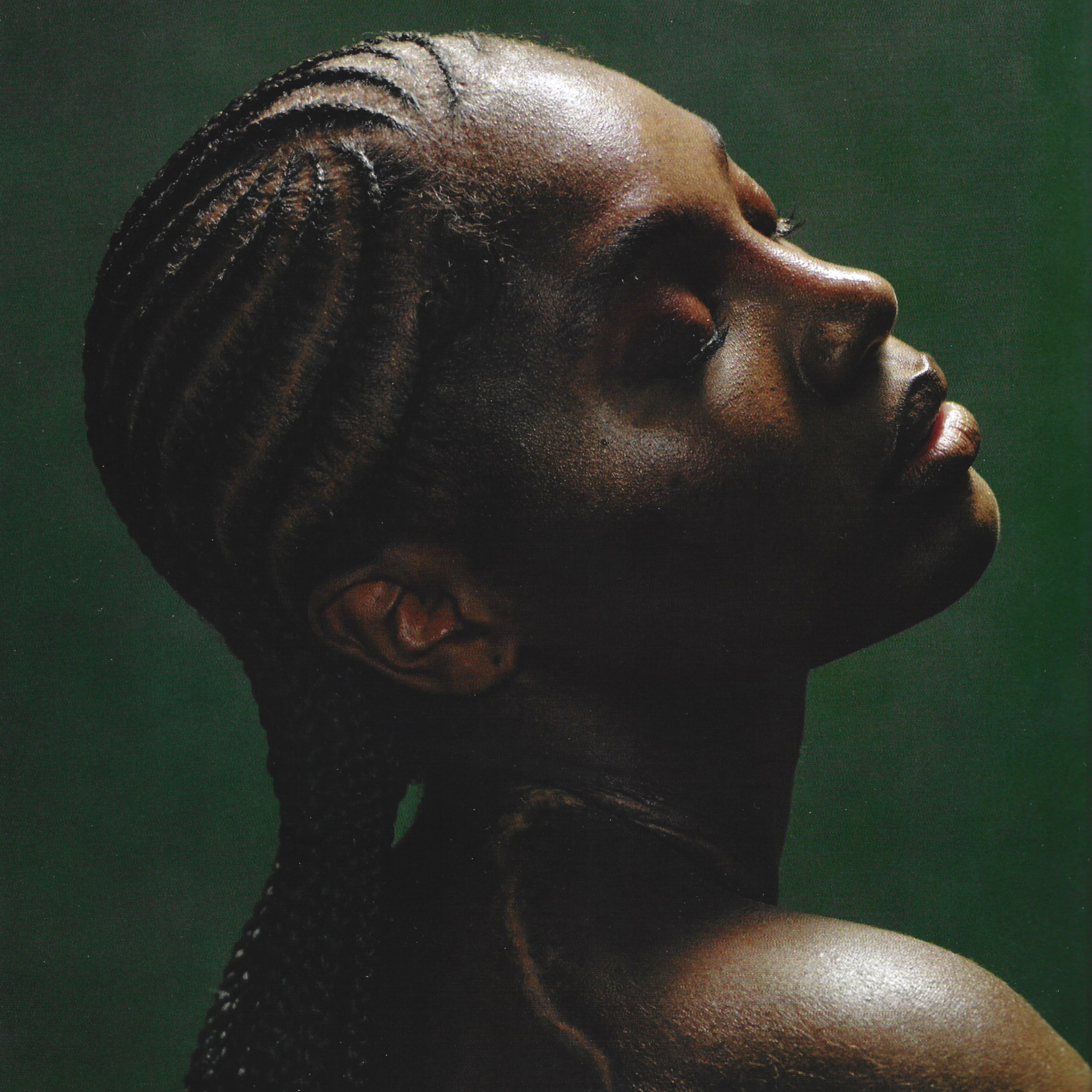 close up of Doechii's face against solid green background